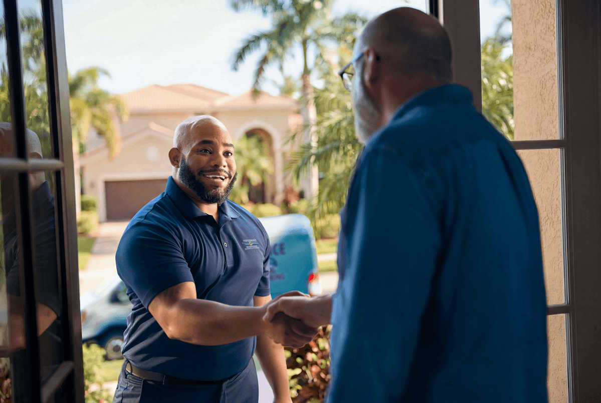 A Performance technician discusses the repair and installation services with a homeowner.